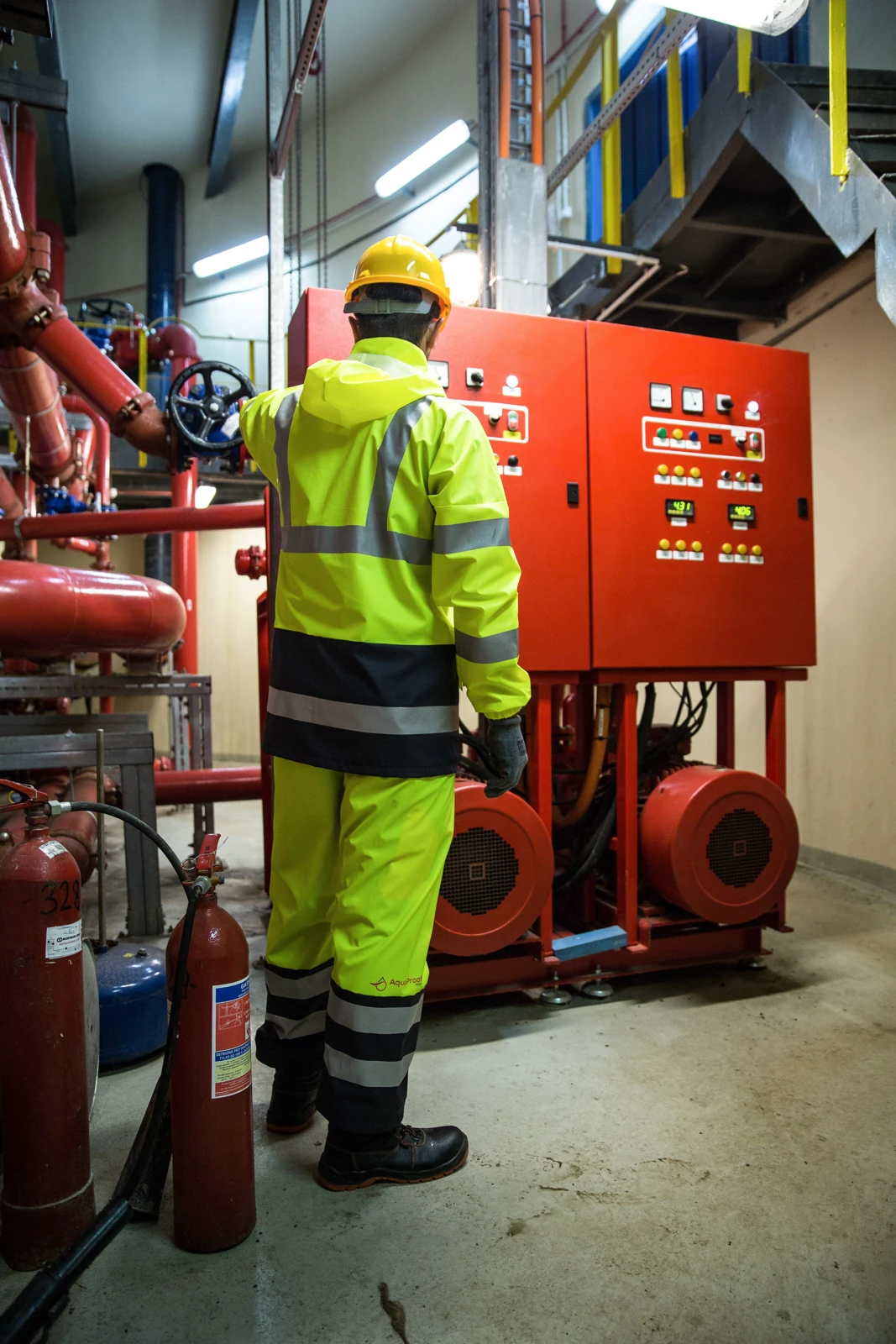 Safety engineer inspecting fire pump controls
